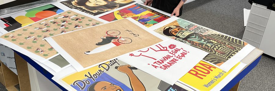 many custom printed posters on tabletop